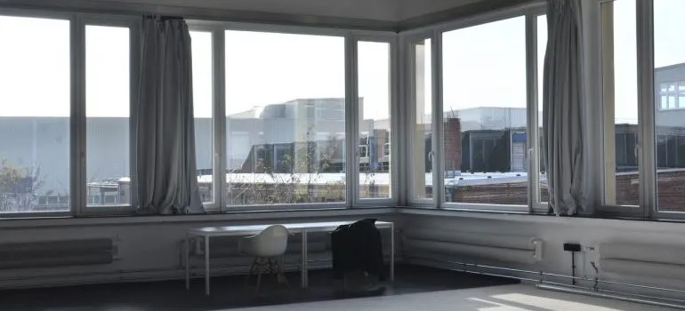 A desk and a chair inside an apartment