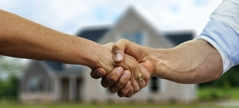 A handshake between two people after helping out your movers.