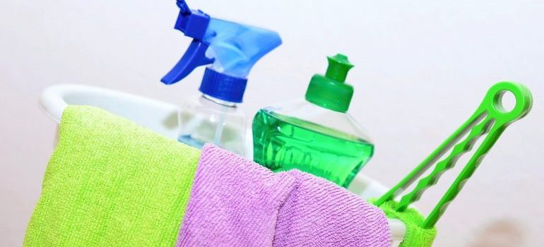 A bucket full of cleaning supplies that will help you have a stress-free spring move.