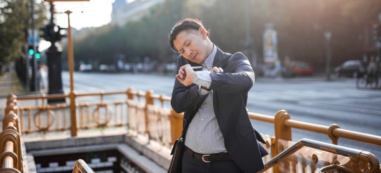 A man looking at his watch.