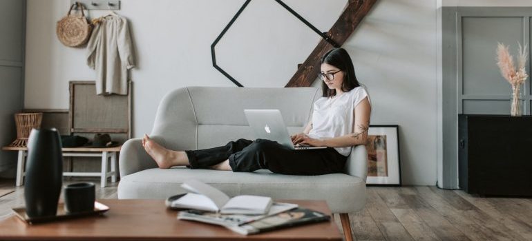 A woman making a moving plan on her laptop.