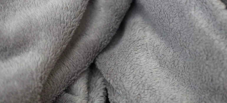 A grey blanket to use when you pack and move a flat screen TV.