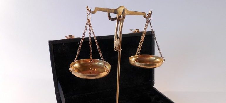Brass scales in a black box.
