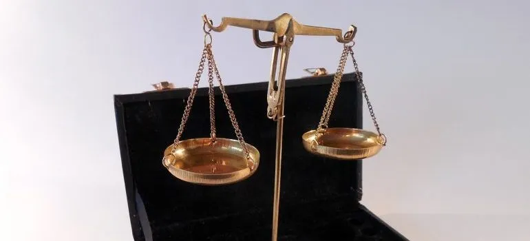 Brass scales in a black box.