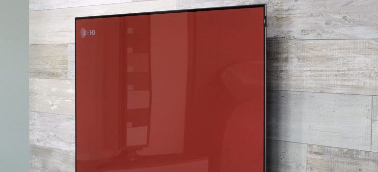 A TV mounted on a wall.