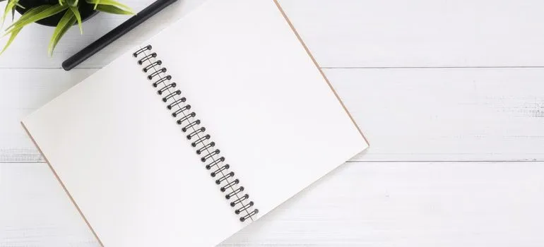 Notebook and pen you need to write down Moving tips for people with disabilities.