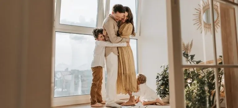 Family hugging after moving from California to Boise