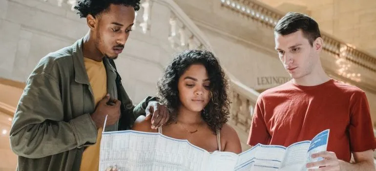 People looking at map before moving from Idaho to Texas