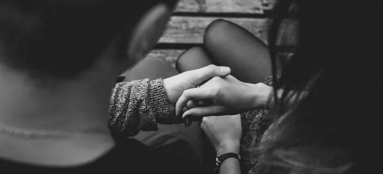 A couple holding hands.