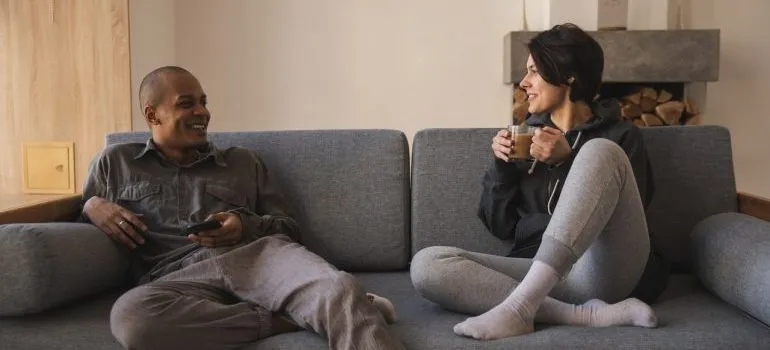 Couple talking about moving tips for newlyweds