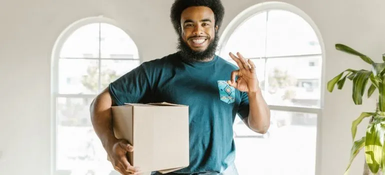 Man carrying an essentials box
