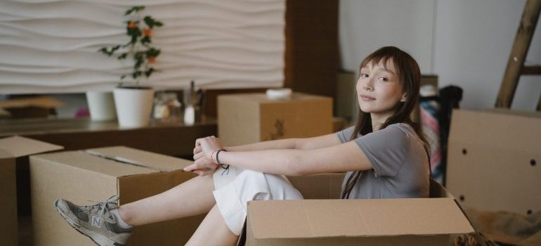 Woman getting ready to pack after learning the tips for moving a pool table
