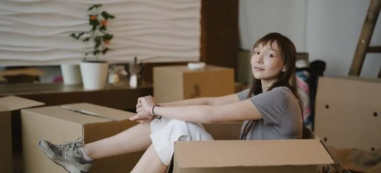 Woman getting ready to pack after learning the tips for moving a pool table