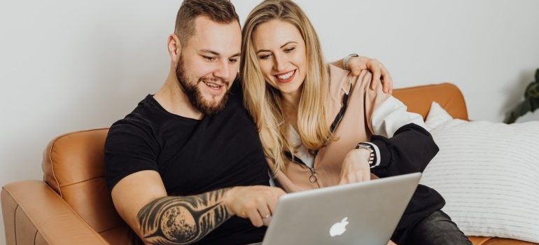 Couple reading about the benefits of self storage while deployed
