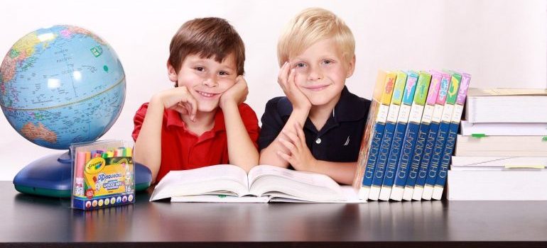 Two boys in school - one of the benefits of moving on a weekday.