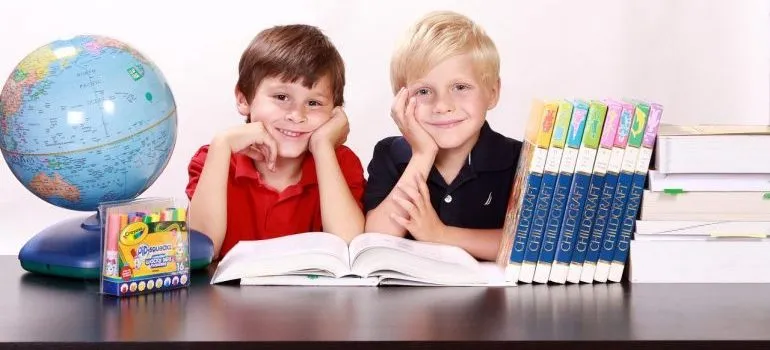 Two boys in school - one of the benefits of moving on a weekday.