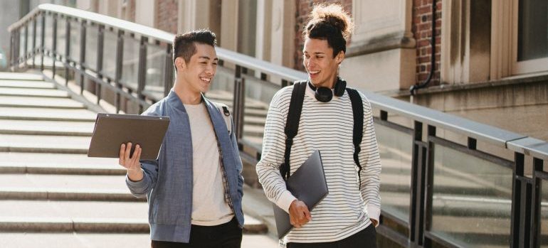 Two students walking.