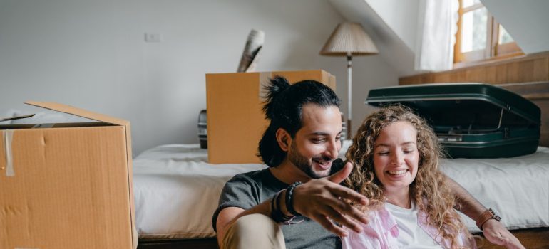 A cheerful young couple after the move.