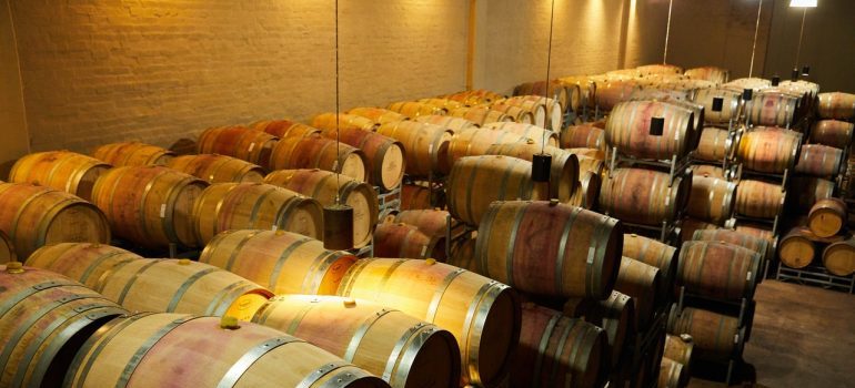 A basement filled with barrels.