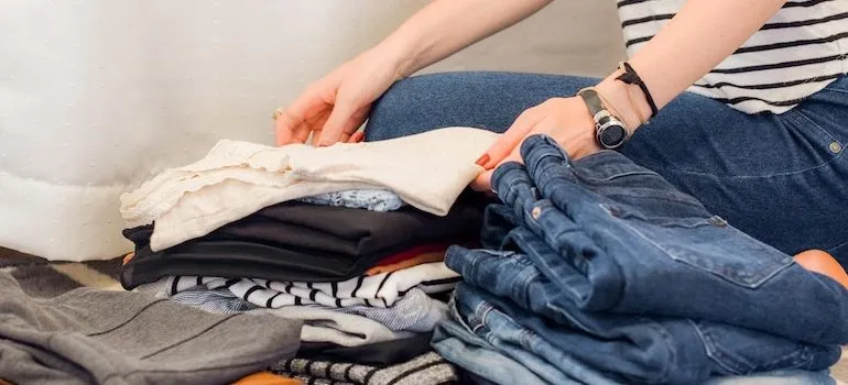 hands sorting through clothes