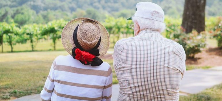 two seniors strolling through the countryside