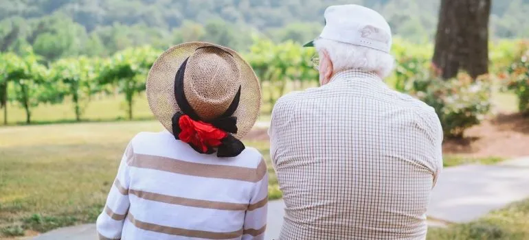 two seniors strolling through the countryside