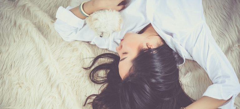 A girl sleeping on a bed.