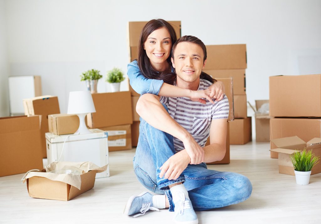 A young couple in their new home - moving tips for young couples