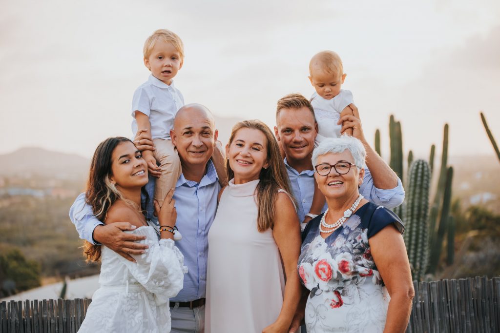 a family standing together, symbolizing the best way to help your family members move