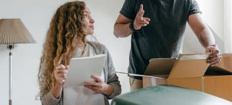 Two people composing a checklist 