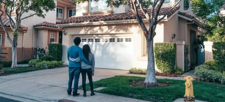 A young couple looking at a house 