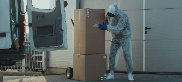 person moving from Boise to Phoenix in a sanitary suit