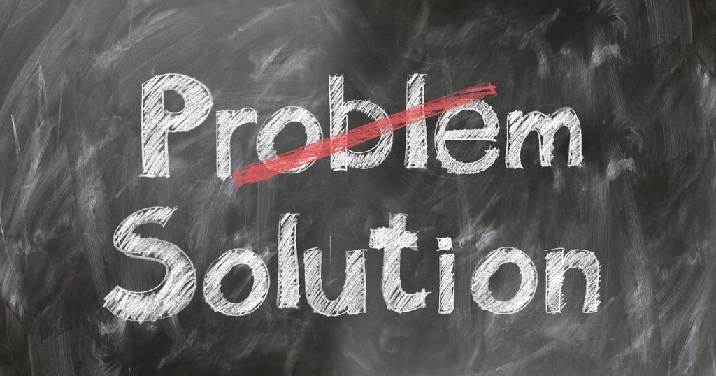 Problem and solution written on a blackboard, signifying packing mistakes that you should avoid.