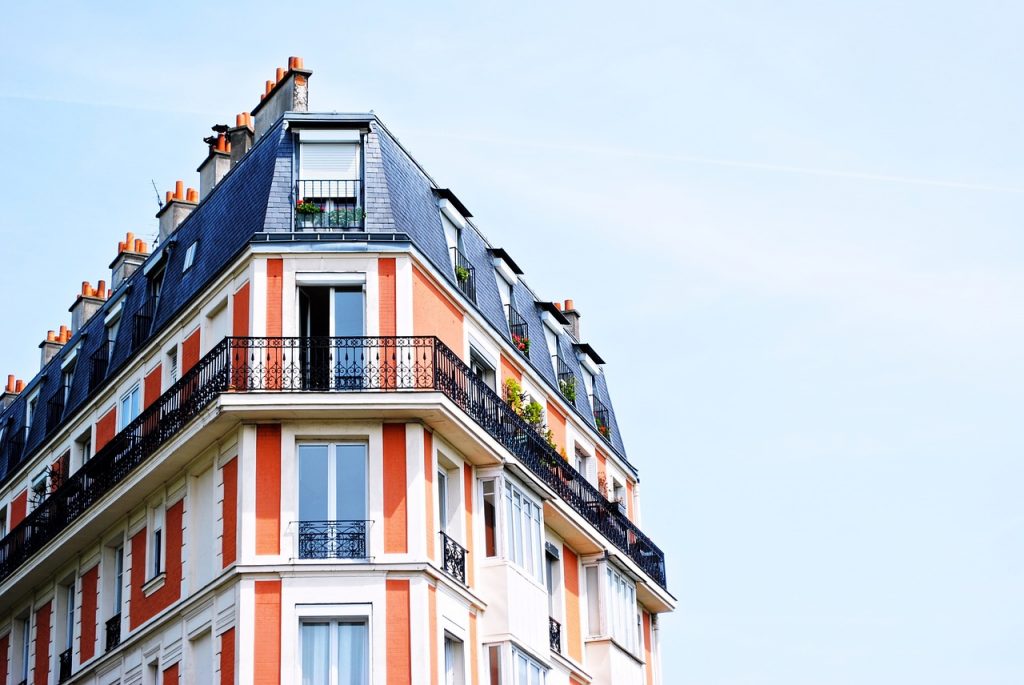 An apartment building with balconies.