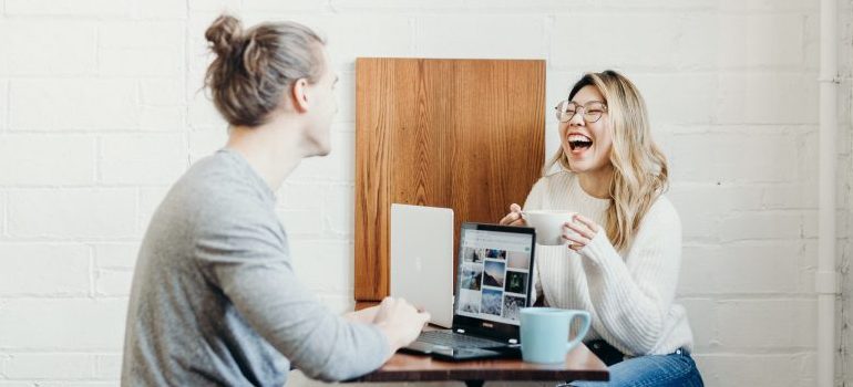 two people talking over a cup of coffee