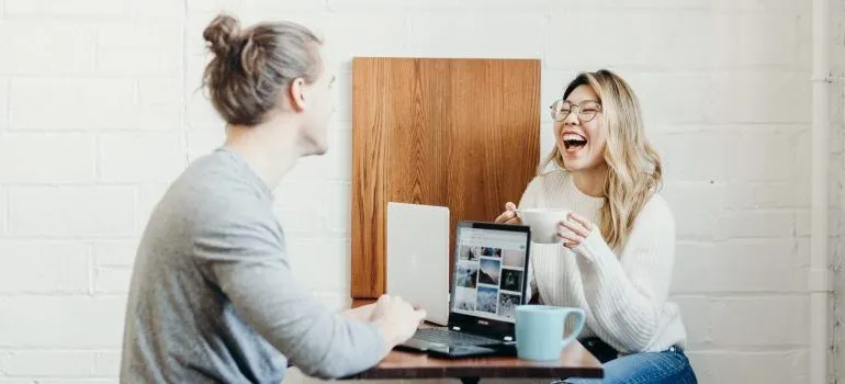 two people talking over a cup of coffee