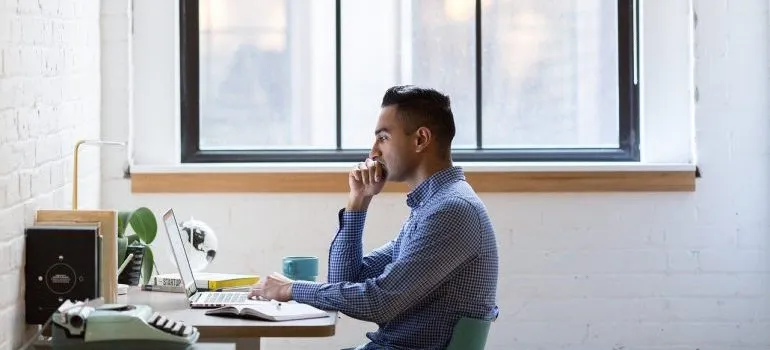 A man looking at a laptop.