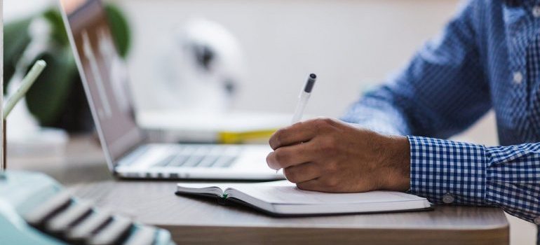 A man writing down notes.