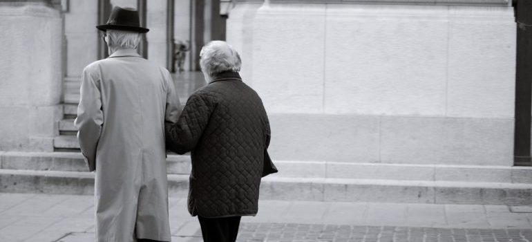 Senior citizens walking down the street.