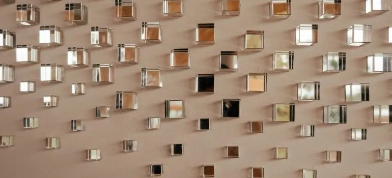 a lot of small mirrors on a wall