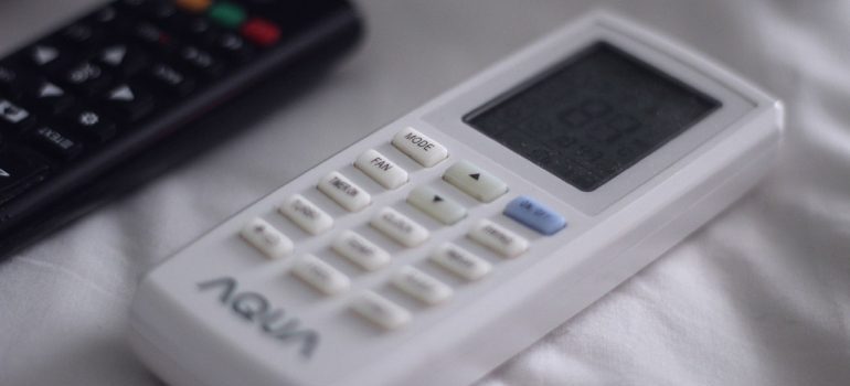 A remote for AC - one of the most important rental apartment amenities.