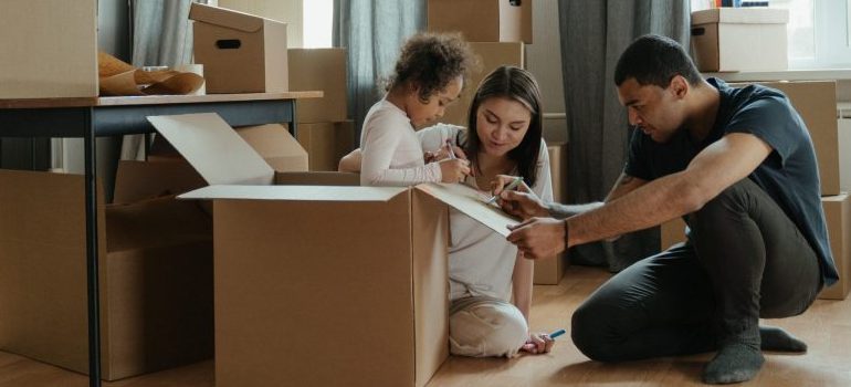 a kid helping in the moving process, showing how to prepare your child for relocation