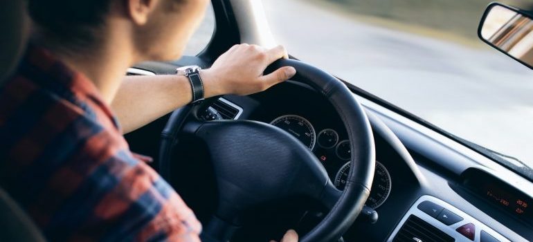 Person driving a car