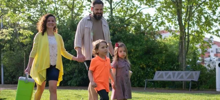 a couple with two kids, in a walk