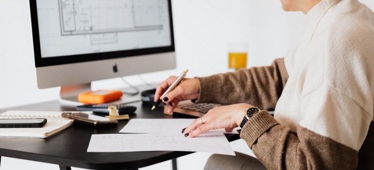 A person making a timeline for moving abroad