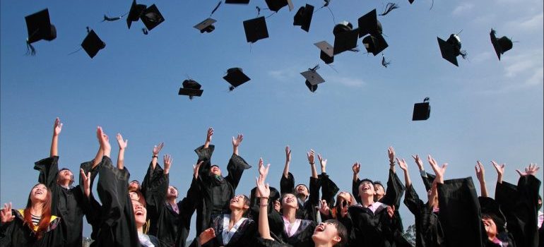 Students throw hats off
