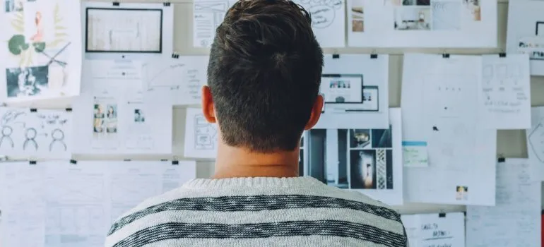 A man looking at a moving plan 