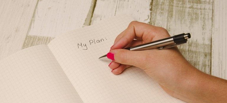 person writing down a plan