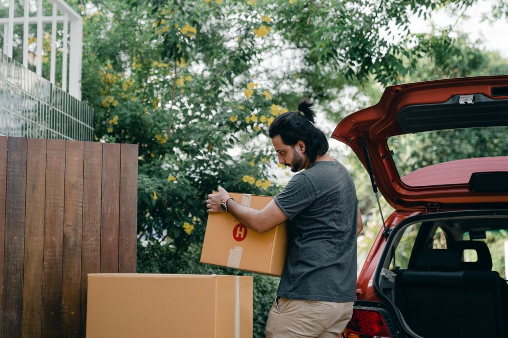man moving with his car