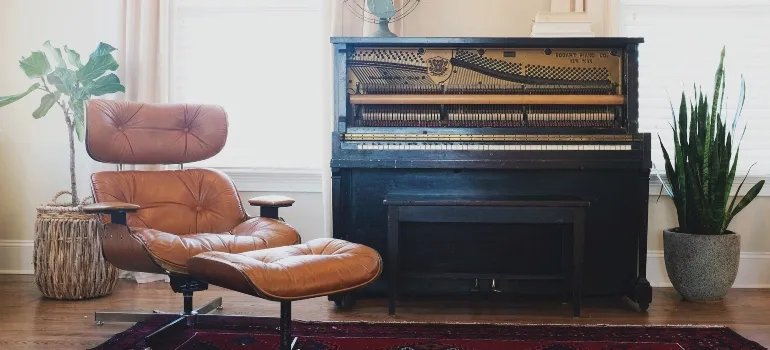a piano and a reclining chair